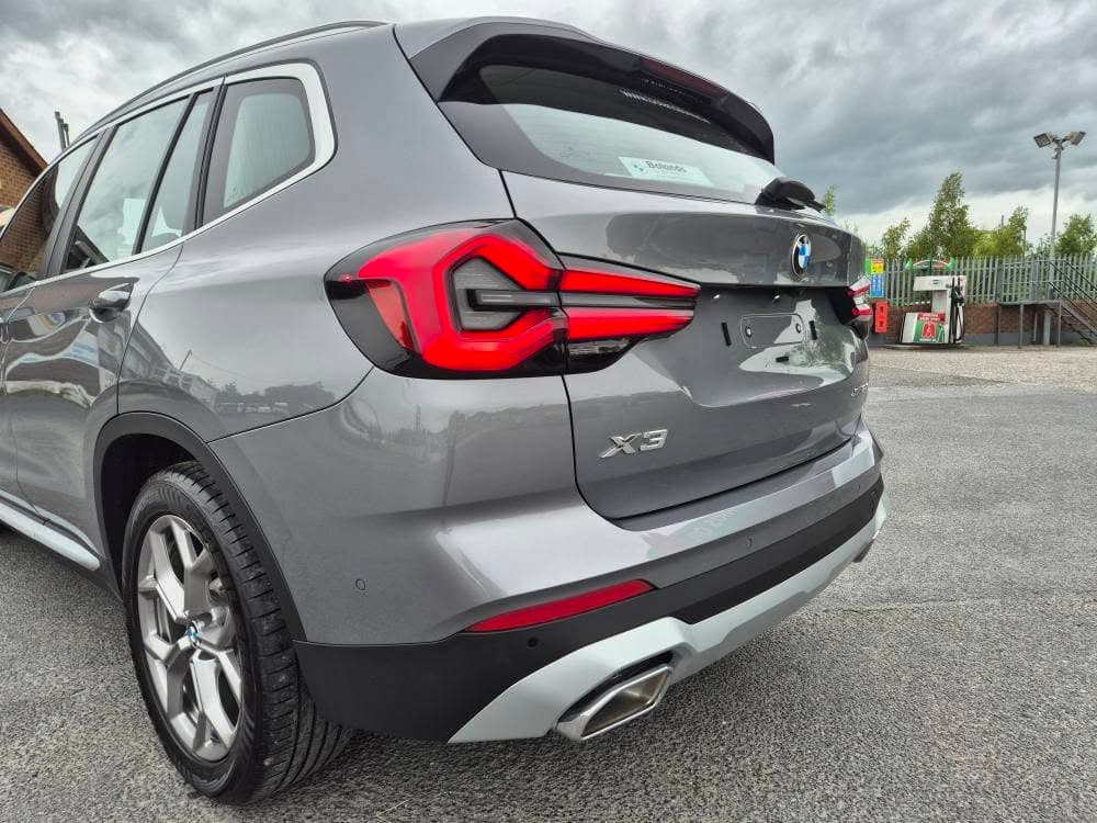 Grey BMW X3 — rear-quarter close-up after exterior decon and gloss seal